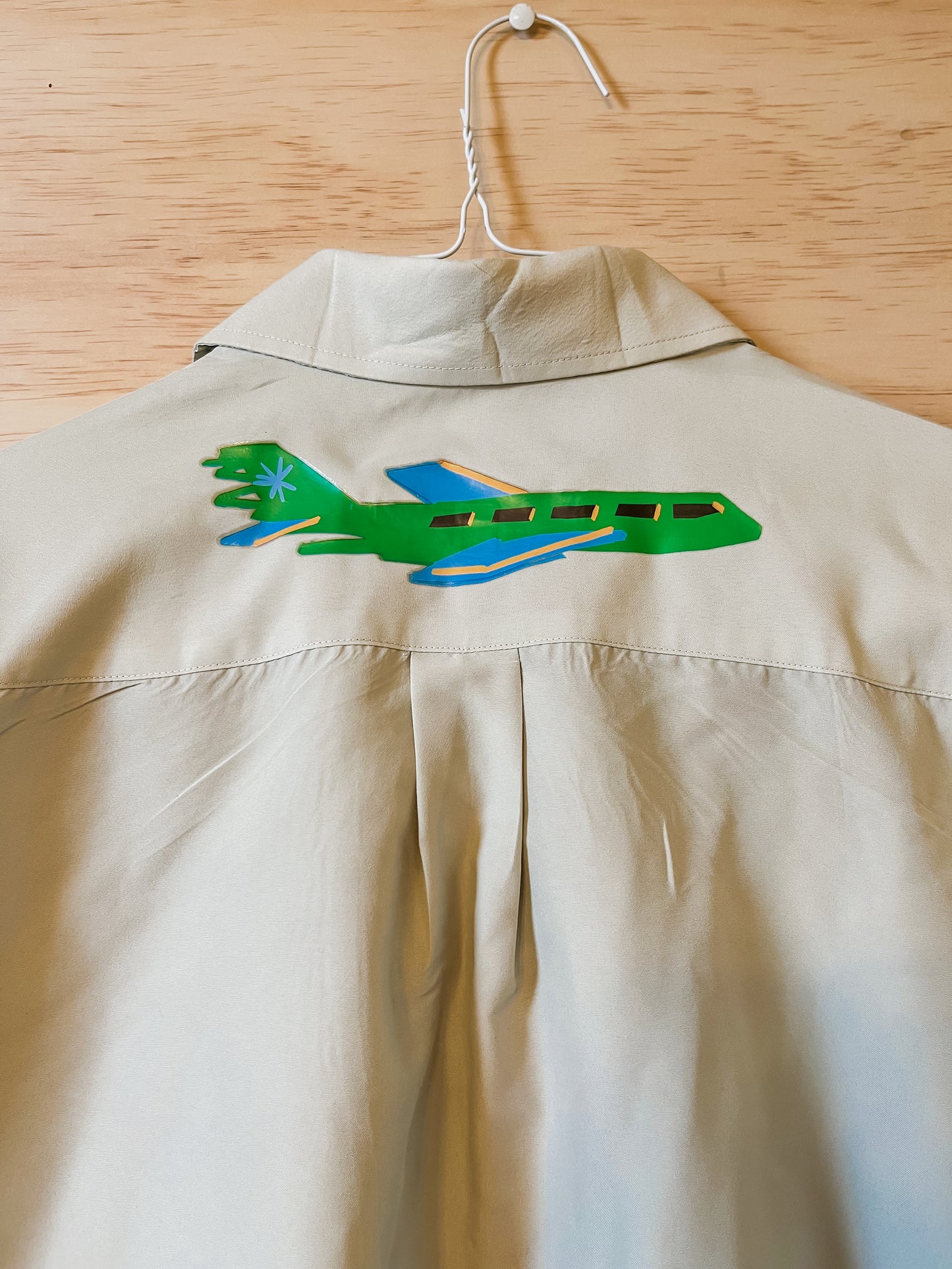 Beige/Green-ish Shirt With Small Planes on Chest